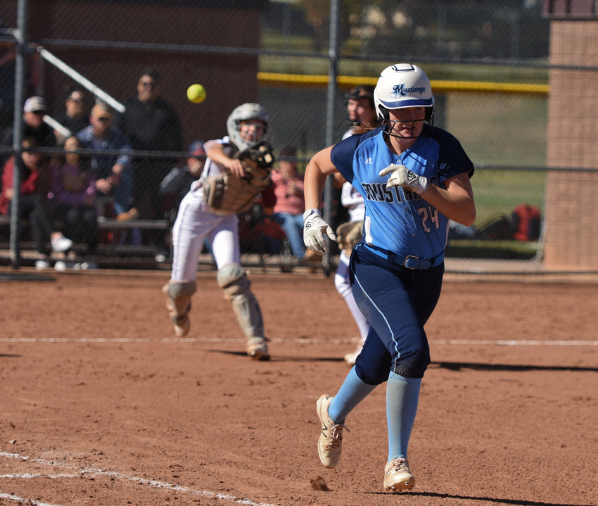 Ralston Valley's Riley Kline is thrown out at first by Horizon catcher Reagan Diamond during a second-round CHSAA 5A regional playoff game at Horizon High School Oct. 16. The top-seeded Hawks advanced to the state tournament by beating the Mustangs, 8-2, and Highlands Ranch 14-1 in an earlier game.